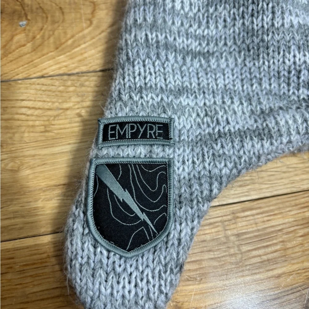 EMPYRE Gray Knit Hat with Braided Tassels